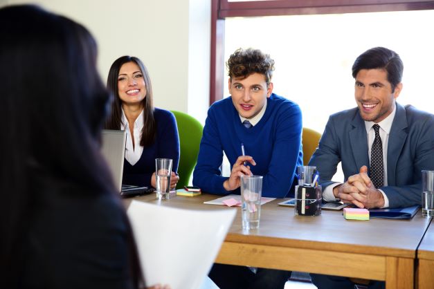 business-woman-sitting-at-interview-in-office-SBI-300858755