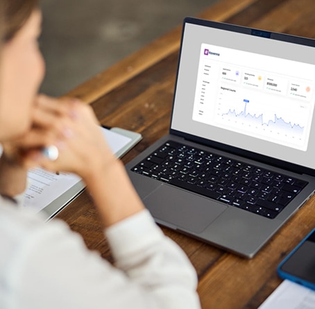 A school administrator looking at a dashboard of Ravenna Admissions and SSS Financial Aid analytics