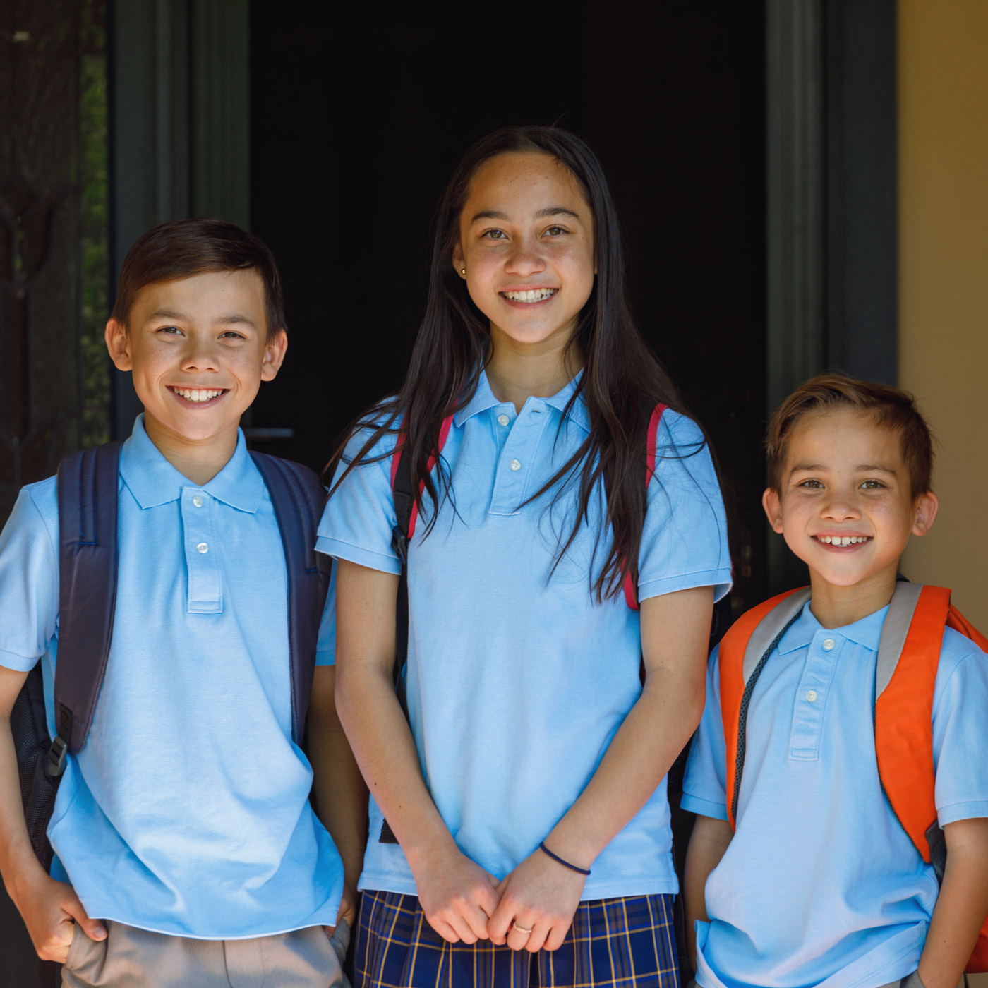 Group of school children smiling at camera