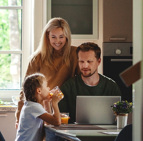 A family enrolling for private school on their computer