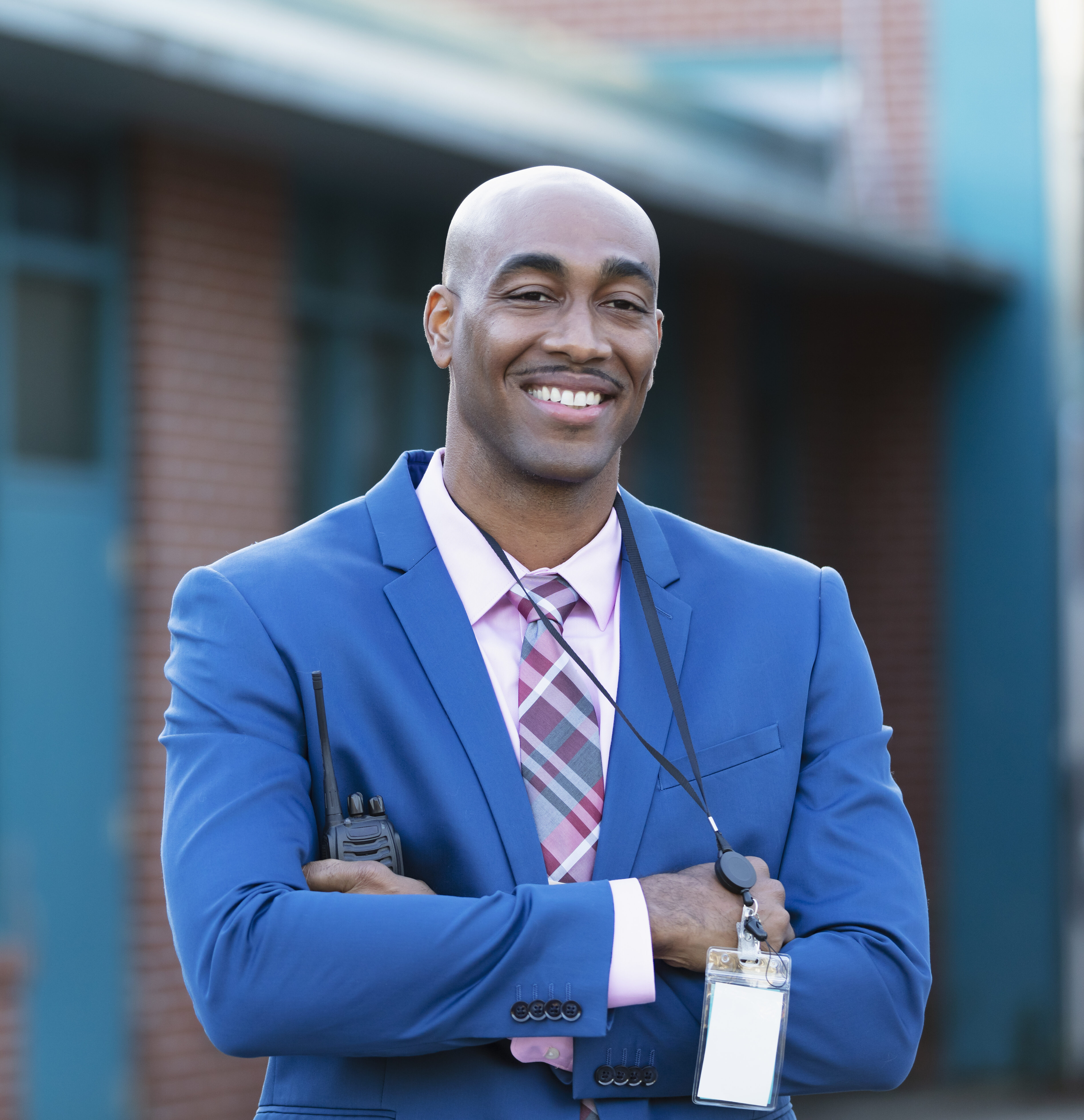 Private School Administrator smiling outside of a building