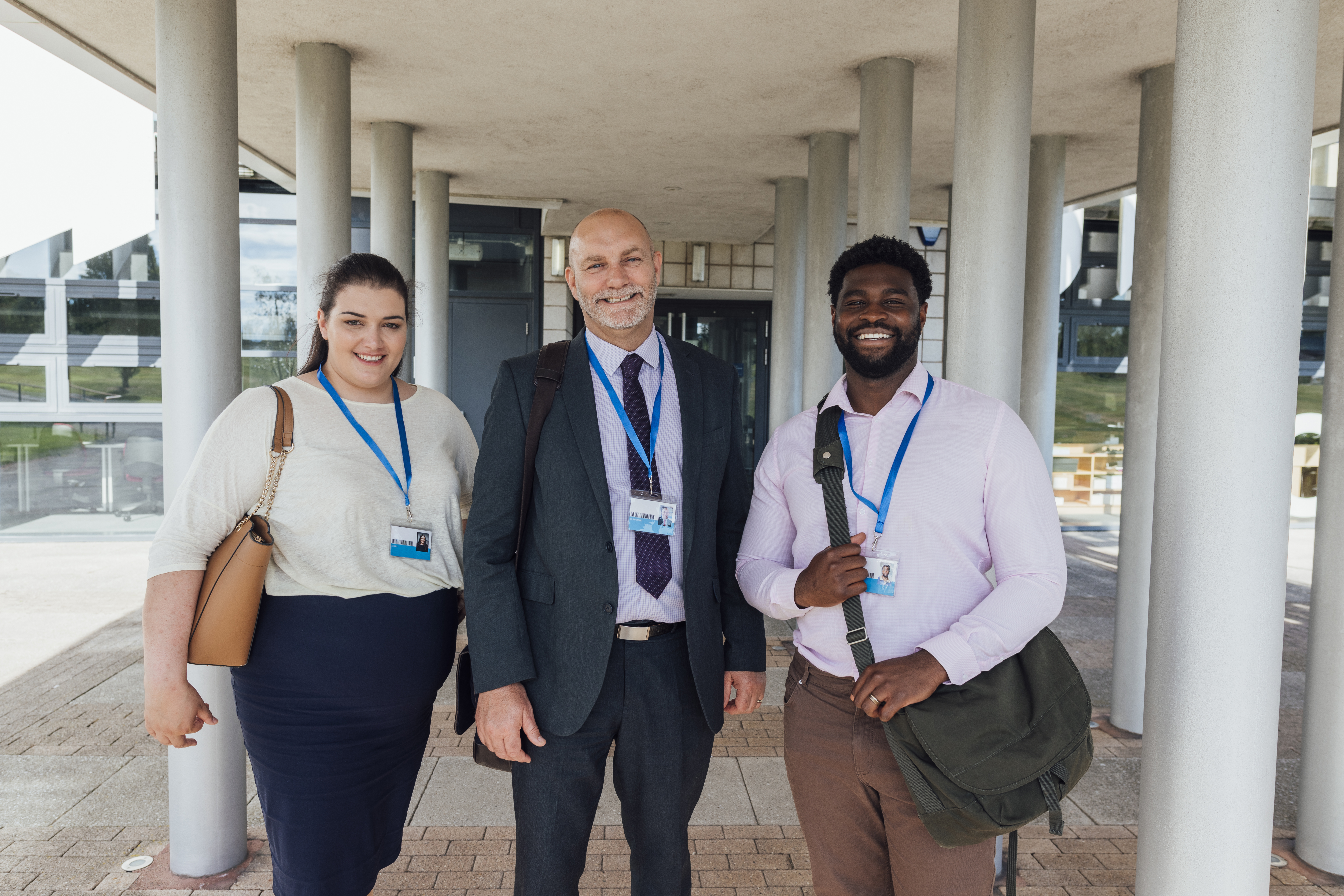 Administrator with other teachers outside of a school