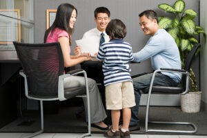 an admissions director interviews a student and his parents